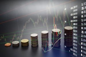 Creative forex chart on monitor. Finance and invest concept. Double exposure. Growing Money - Plant On Coins - Finance And Investment Concept